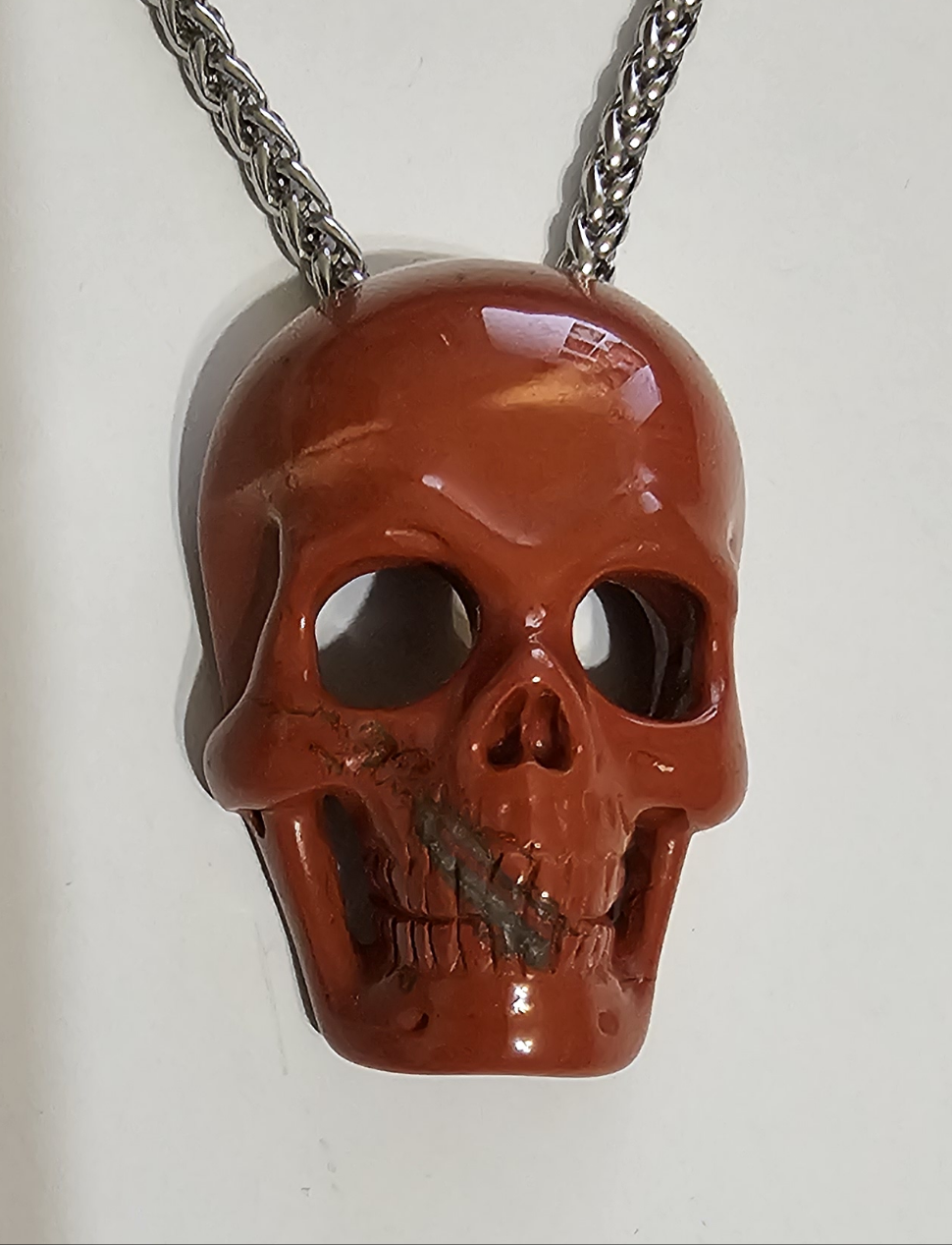 Red Jasper, Skullis, hand carved skull with invisible bale & stainless steel chain.