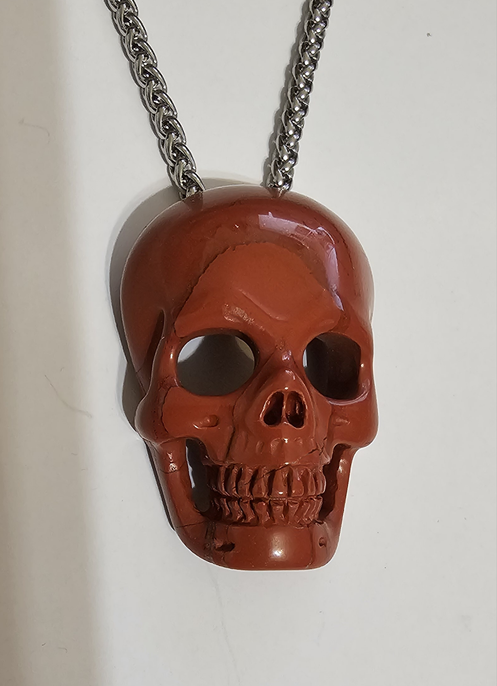 Red Jasper, Skullis, hand carved skull with invisible bale & stainless steel chain.